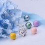 Collier bola de grossesse fleurs avec boule bleue